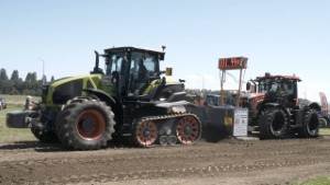 2024 Claas Axion 960 Tractor Pulling a 2024 JCB 4220 Tractor