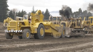 Caterpillar D9G Bulldozer pushing a CAT 630B Scraper