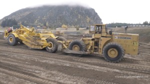 Michigan 280B Wheel Dozer pushing a 1961 Caterpillar DW21 Scraper