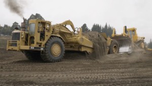 Caterpillar 651B Scraper getting pushed by a CAT D10 Bulldozer