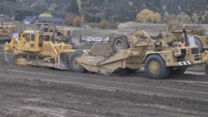International Harvester TD25C Bulldozer pushing a Caterpillar 621 Scraper