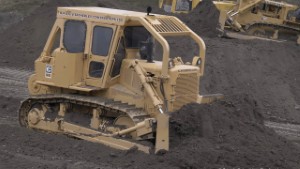 Old Caterpillar D7G Bulldozer Pushing Dirt