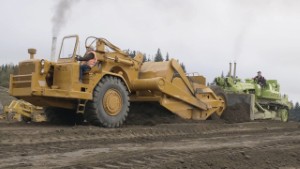 Euclid TC-12 Bulldozer Pushing a Caterpillar Cat 619 Scraper