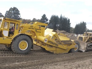 Caterpillar D9G Bulldozer Push Loading an IH 295 Payscraper